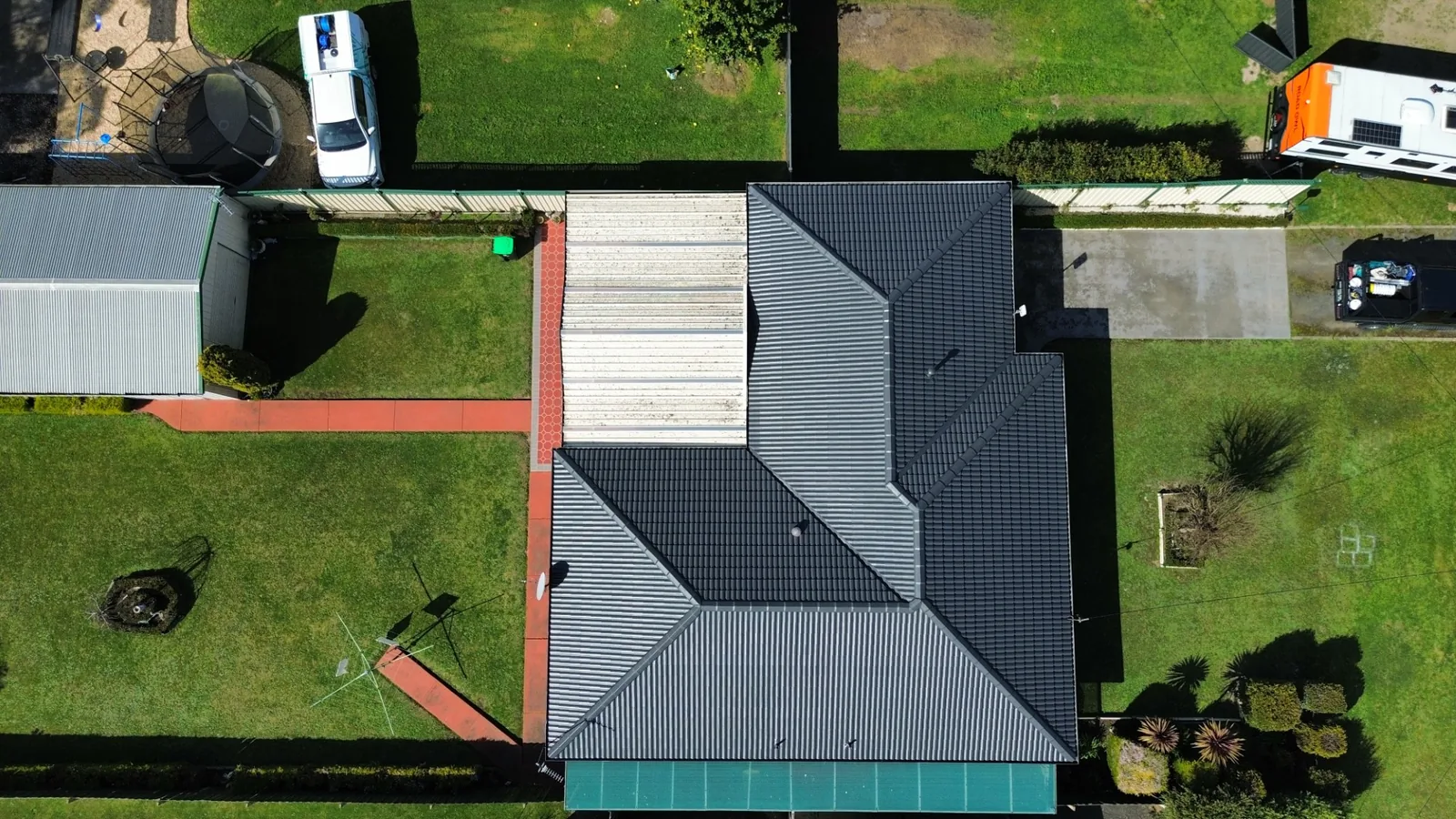 aerial view of a restored charcoal tile roof with solar panels, Gippsland VIC